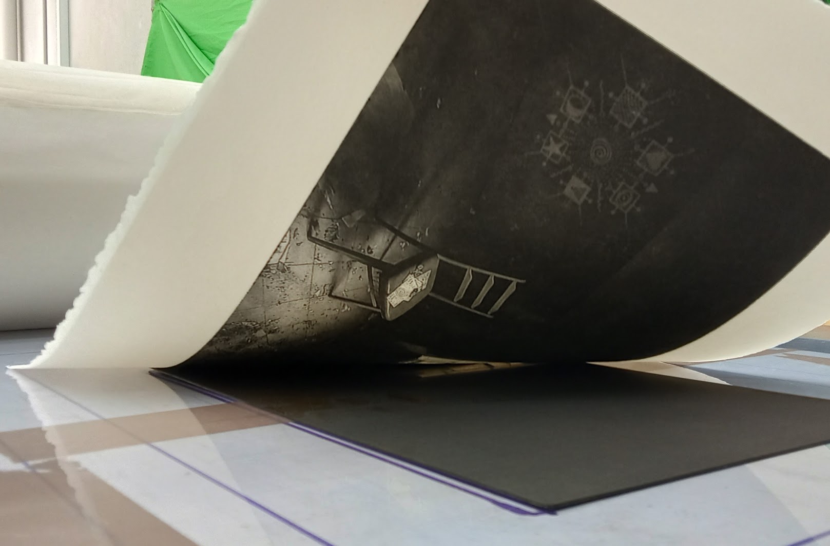 Pulling a copper plate etching print